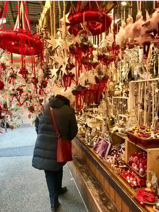 Woman appreciating a Vienna Christmas Market stall